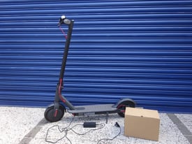 Xiaomi M365 Electric Scooter with charging lead and 2 brand new tyres with inner tubes 