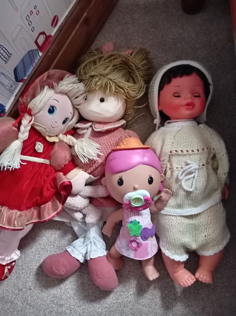 4 Dolls. 2 rag dolls. 2 plastic. 