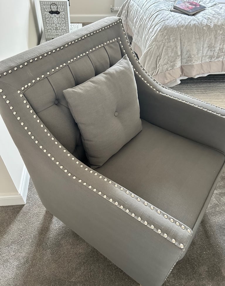 Grey studded armchair