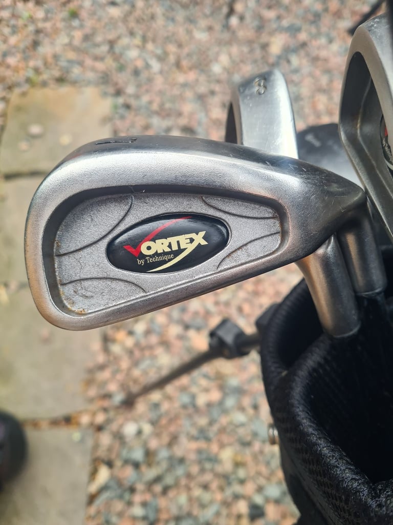 Full set of golf clubs.