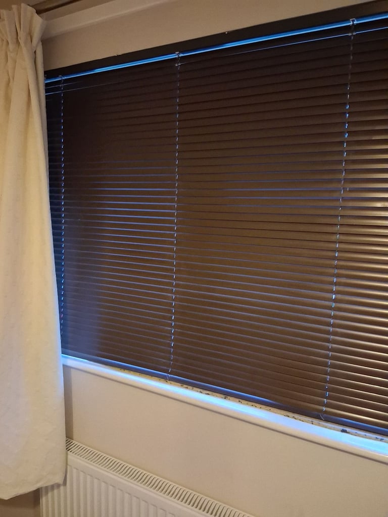 2. Brown Venetian blinds.