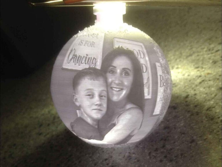 Personalised ANY PHOTO Christmas Tree Bauble Decoration on a snowflake background.