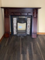 Wooden fireplace and cast iron insert