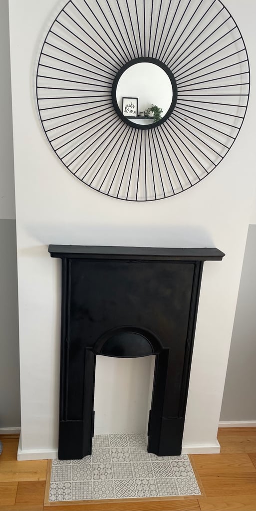 image for Black, restored cast iron fireplace surround with shelf