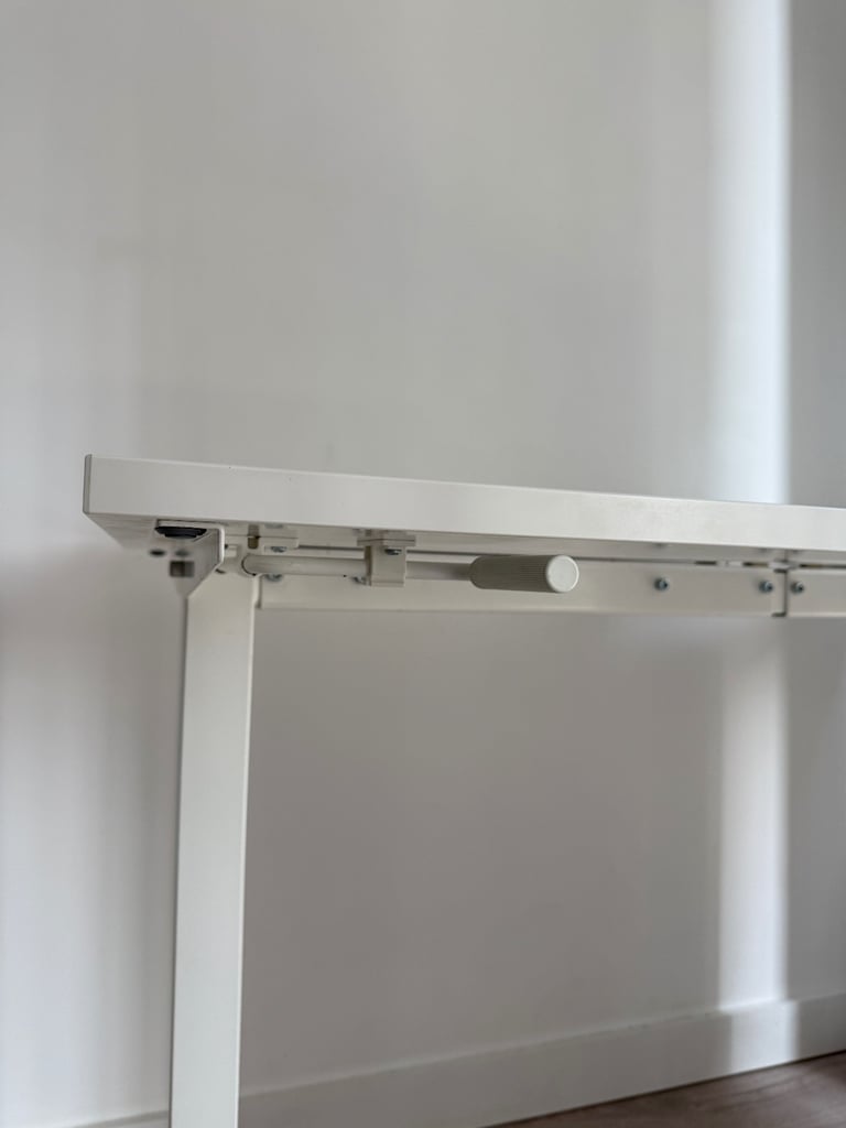image for IKEA TROTTEN Sit Stand Office Manual Height Adjustable Desk, White, 120cm x 70cm