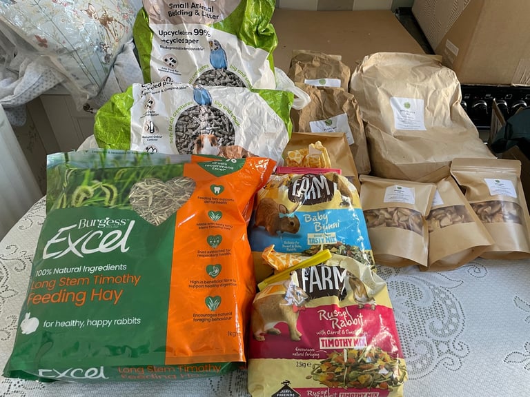 Large Collection of rabbit food,2bags  mix,2bags paper litter,3bags hay, 6 bags apple slices/leaves