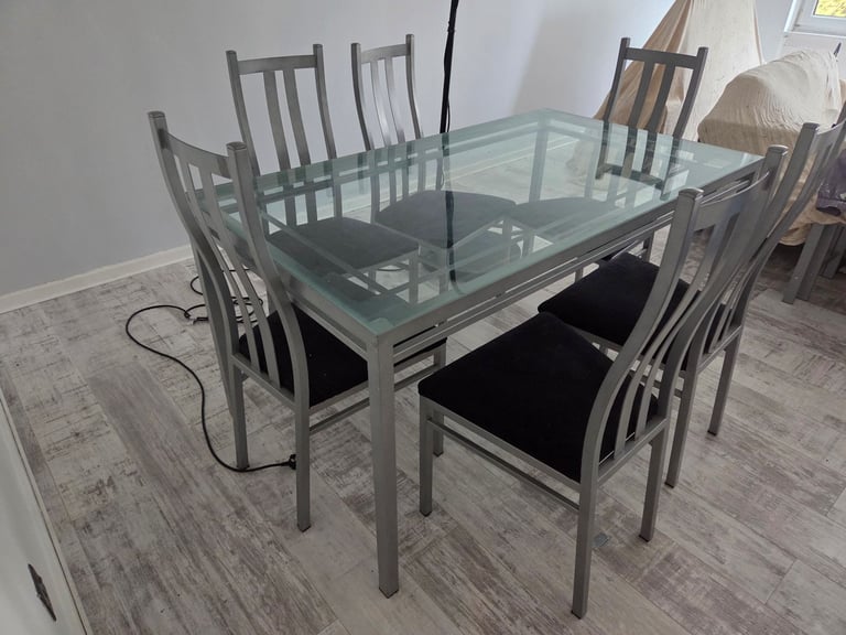 image for Dining room table and chairs.