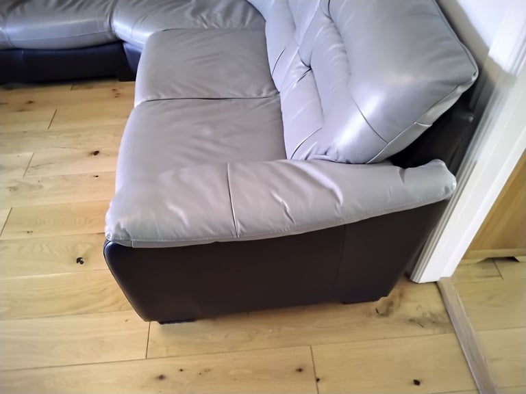 Black and grey leather corner unit.