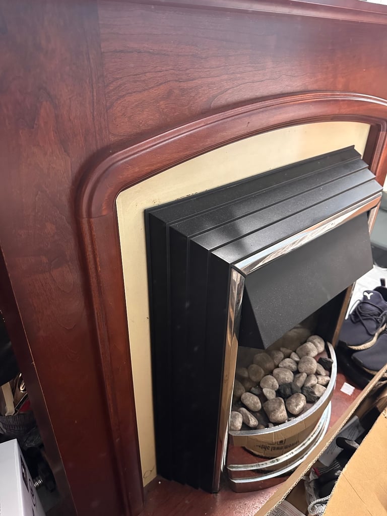 Vintage Wooden fireplace with stone frame 