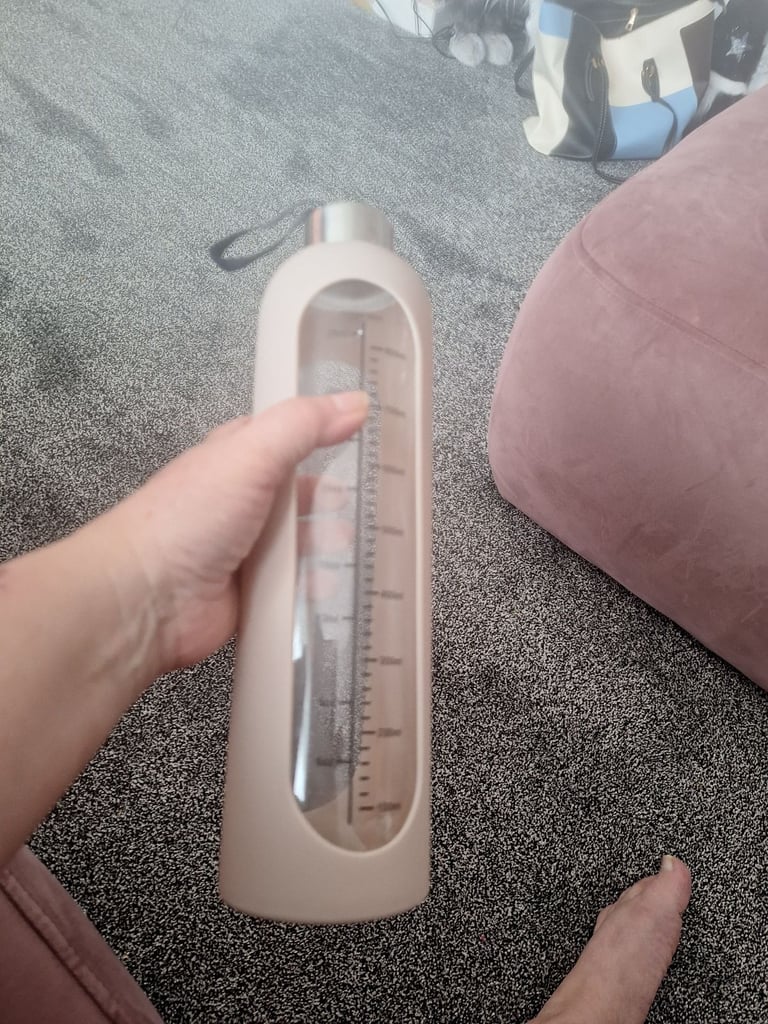Large glass drinking bottle