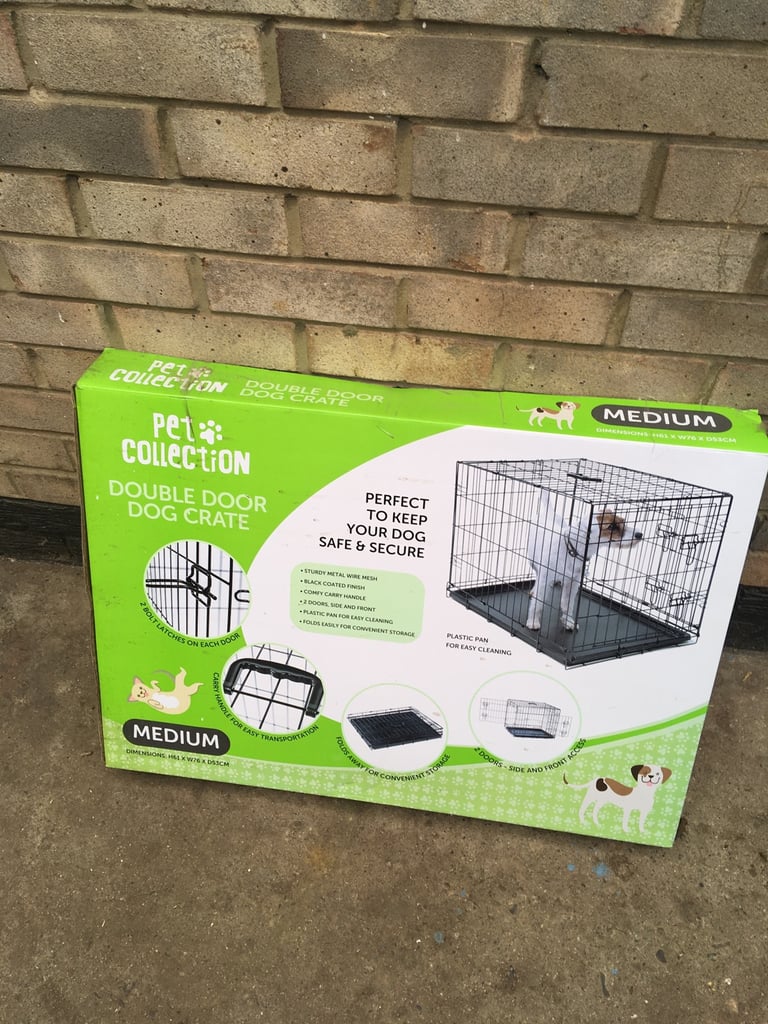 Dog cage, medium sized , folds away, double doors