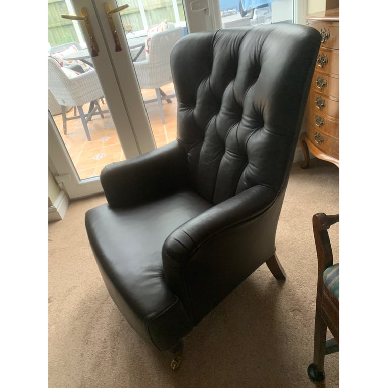 Superb brown leather club chair button back with castors 
