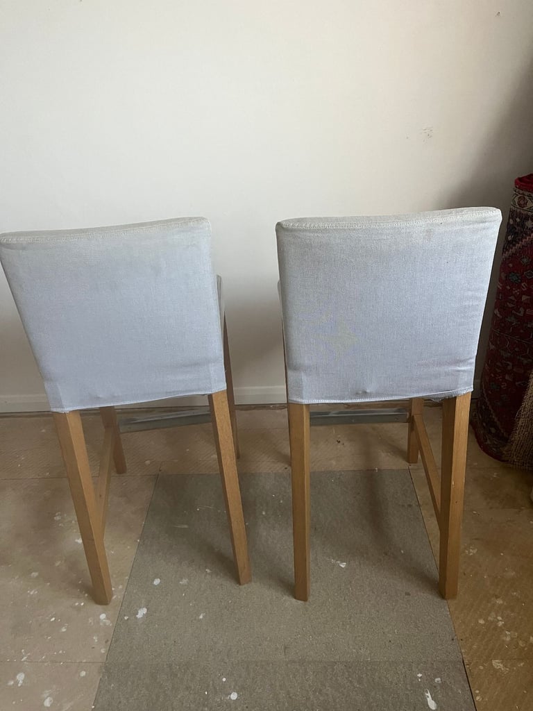 2 IKEA Bergmund Oak Bar Stools with removable covers