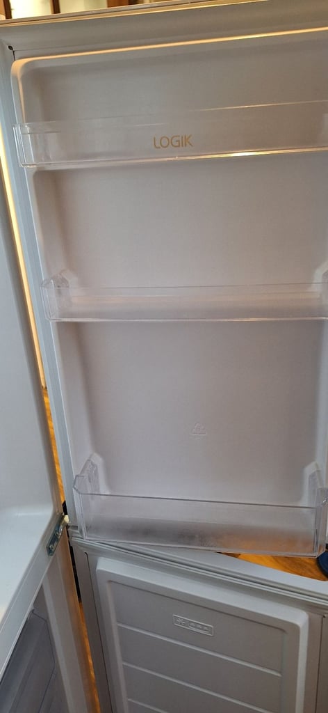 LOGIK fridge freezer size  H 142cm like new one year old 