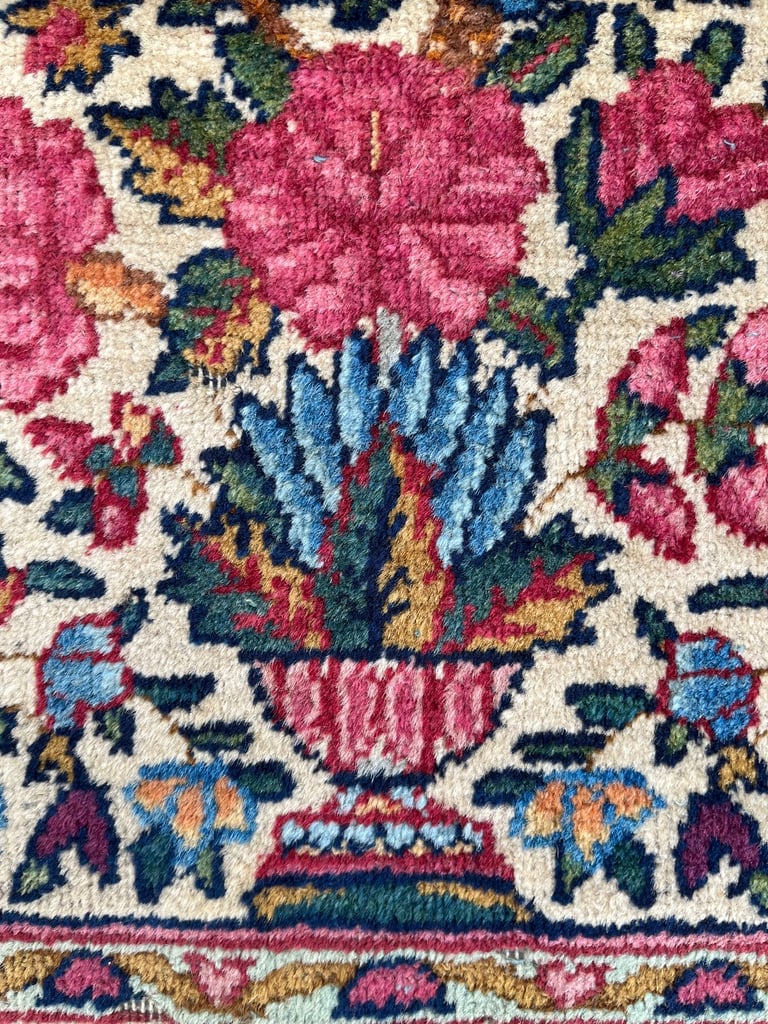 A pair of Antique Kirman mats 