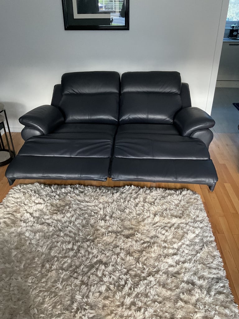 REDUCED PRICE    NEW 2 x 2 seater leather sofas 1 of which is a power recliner