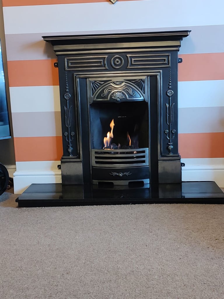 Cast iron fireplace with a gas fire. 