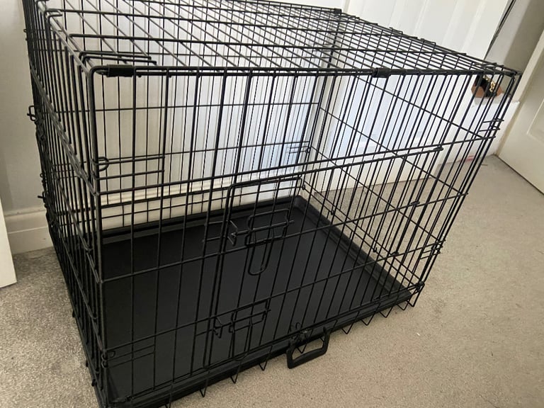 Medium/MLarge Dog crate double doors includes tray. Easy foldaway carry handle 