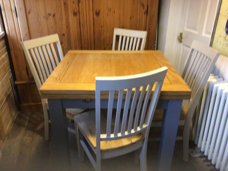 Solid oak table and 4 chairs 