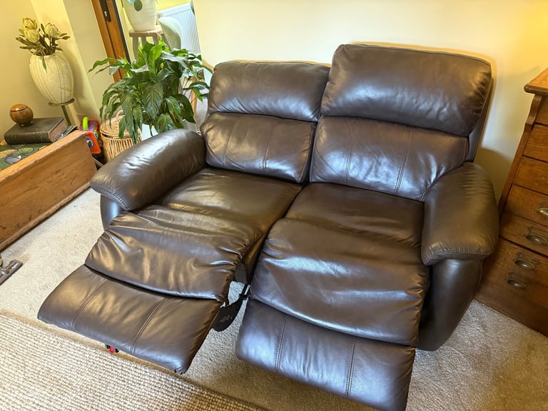 Leather two seater reclining sofa