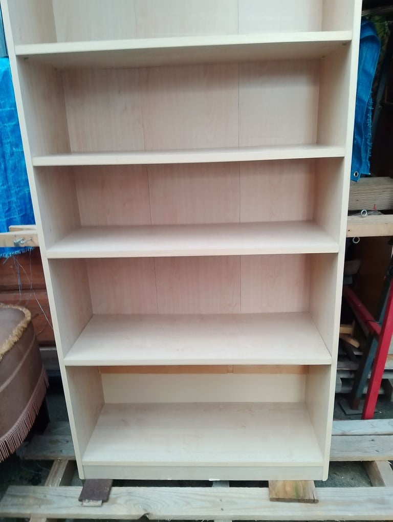 Very tall shelving unit in new condition spotlessly clean inside and out 