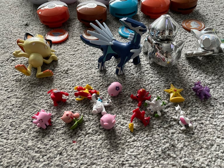 Job lot of pokemon balls figures belt disc launchers