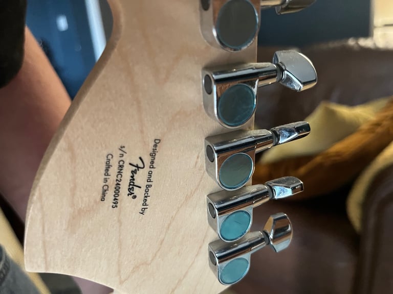 Squier by fender mustang electric guitar in sunburst