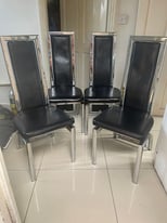4 black and silver dining chairs 