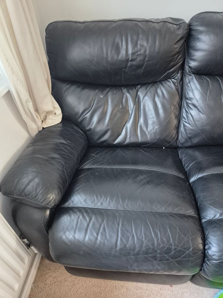 Black leather reclining 3 seater sofa 