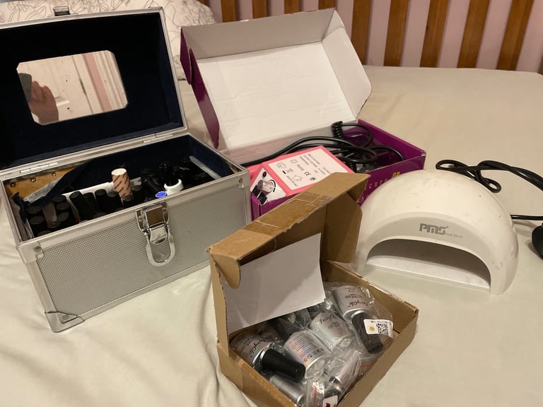 Bundle of gel nail varnishes, lamp and electric file