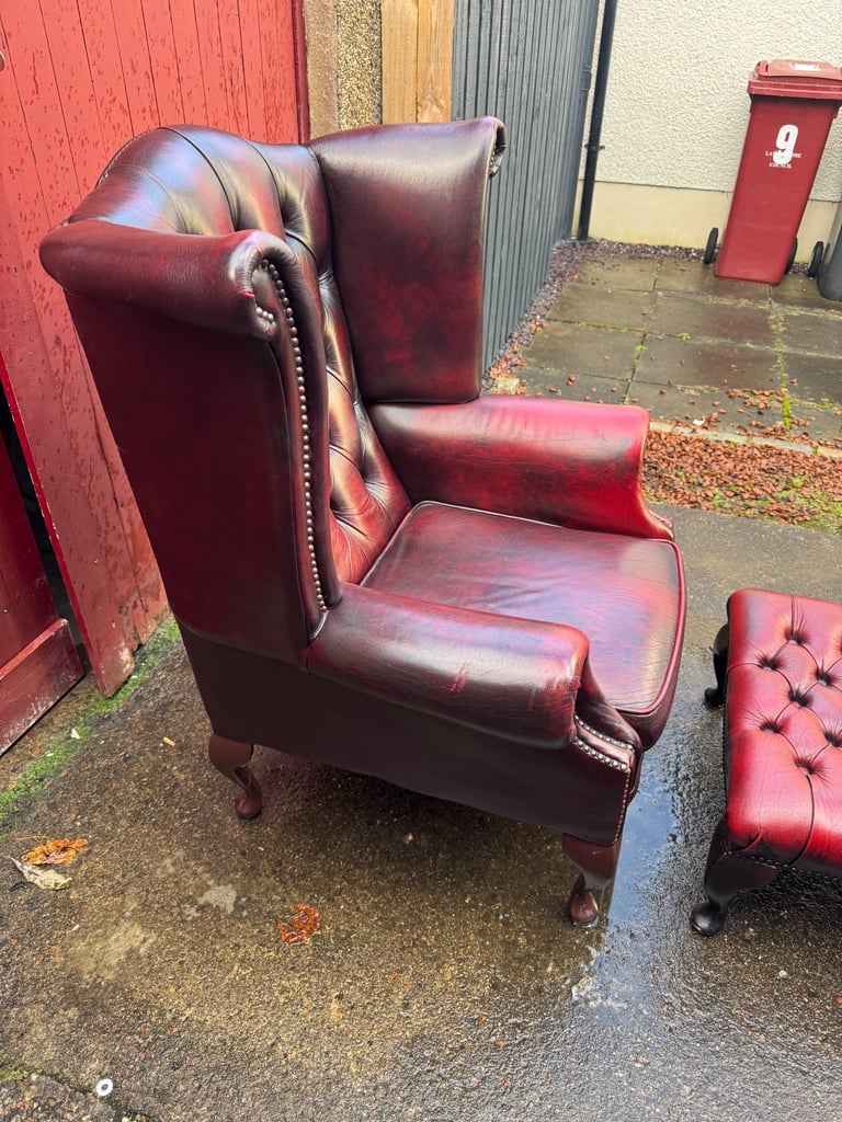 Chesterfield Leather wingback armchair and matching footstool