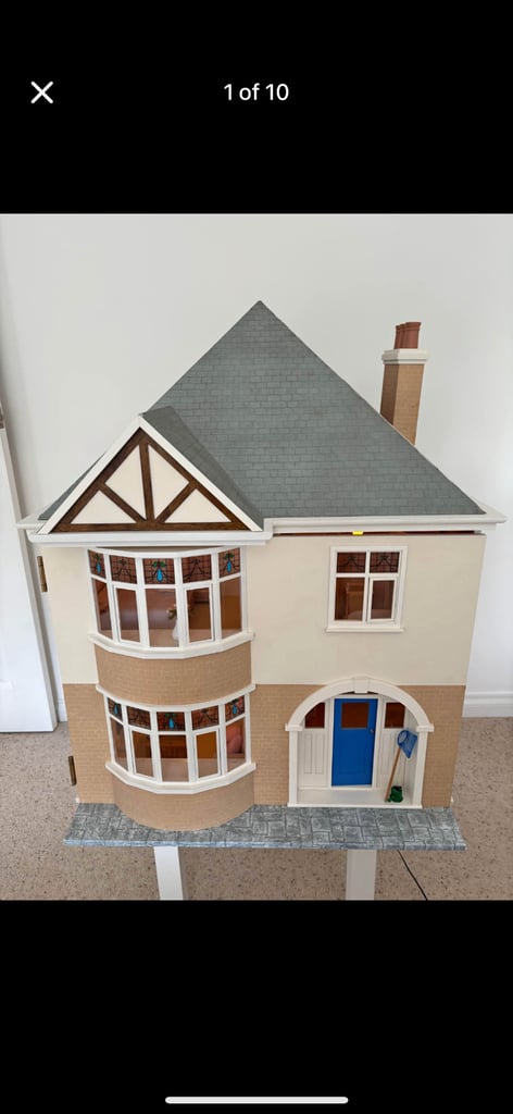 Lovely large dolls house all decorated and has lights no furniture included 