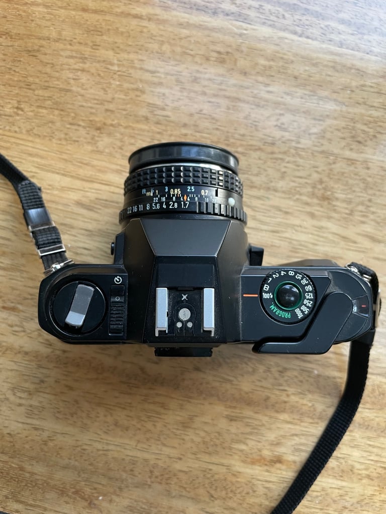 Pentax P30 SLR with 50mm lens; with case plus Tokina 28-70mm lens