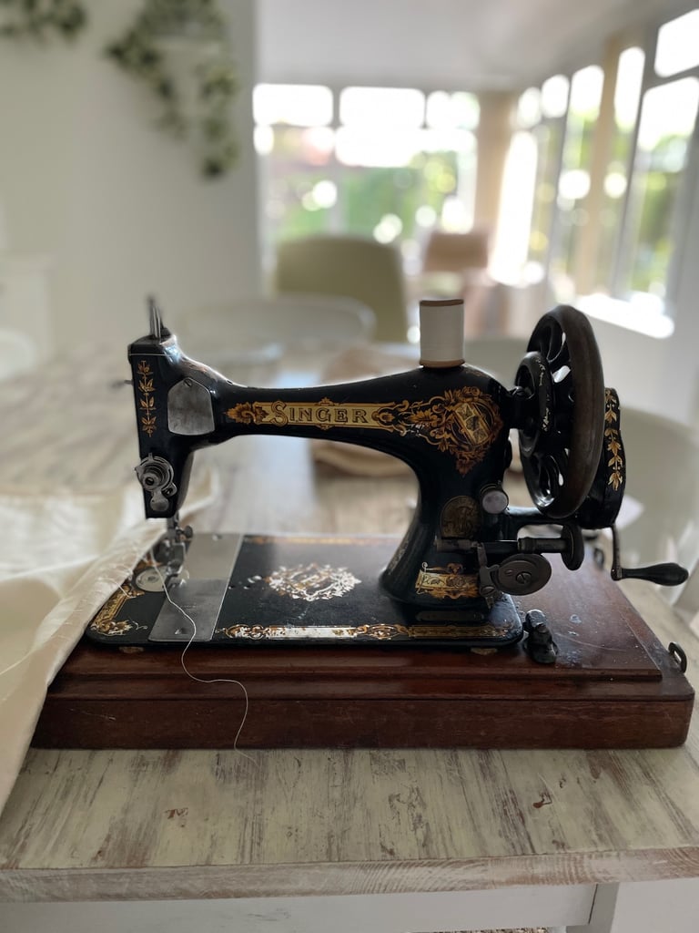 Vintage hand cranked singer sewing machine 