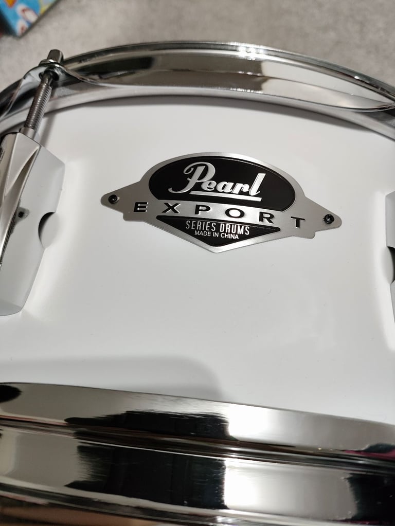 Pearl Remo drum and drumsticks 