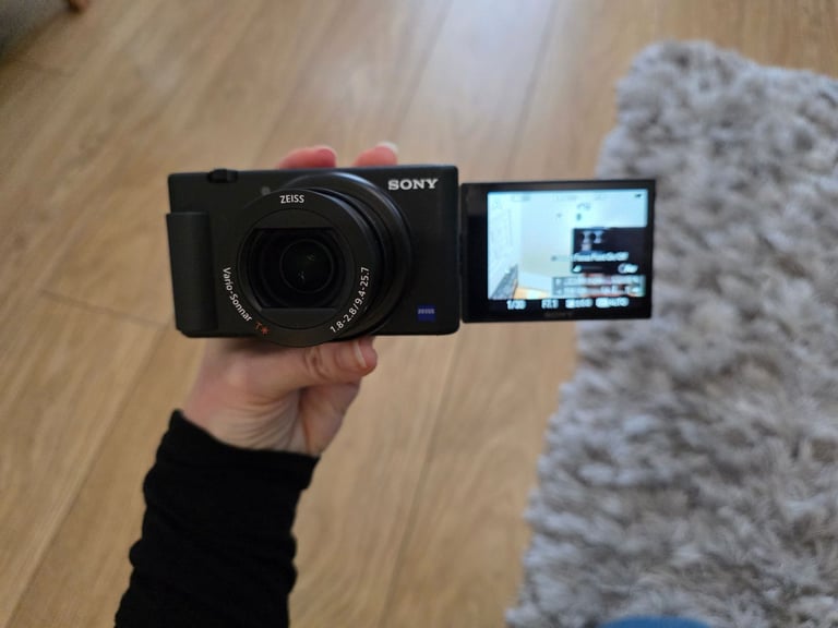 Sony ZV-1 vloggers camera with case, 4x batteries and  tripod camera grip