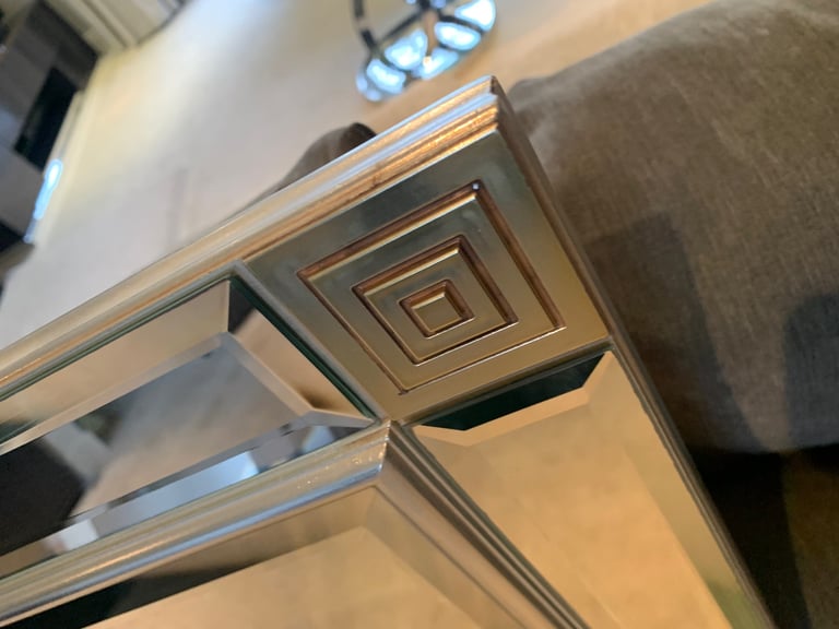Large frameless mirror with corner detailing
