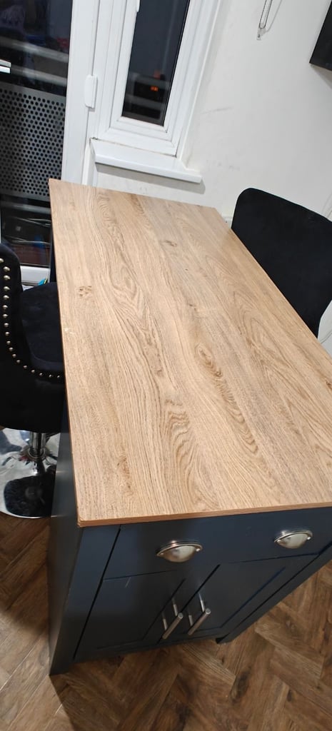 Breakfast bar with two high velvet chairs