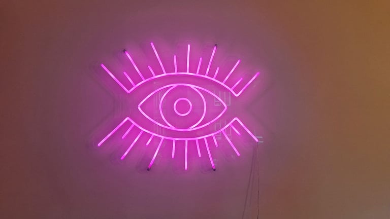pink neon ''evil'' eye wall light