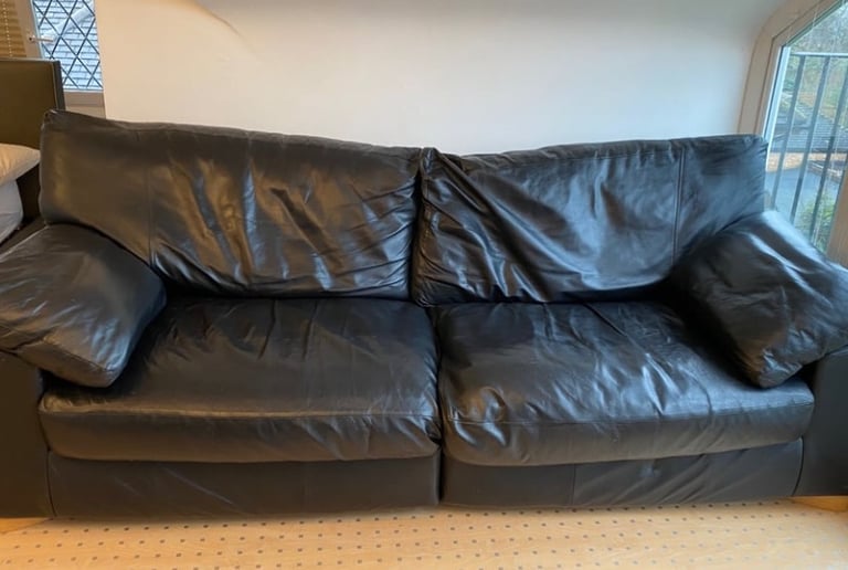 A faux leather sofa in the colour black