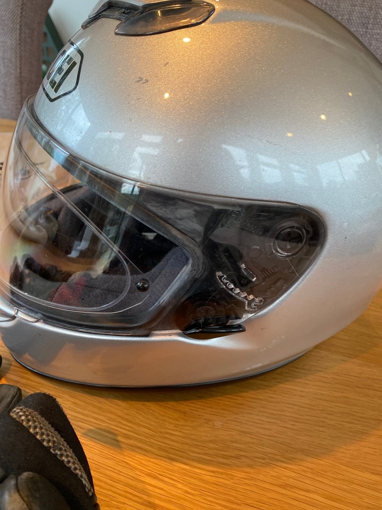 Men’s motorcycle helmet , and two pairs of gloves. 