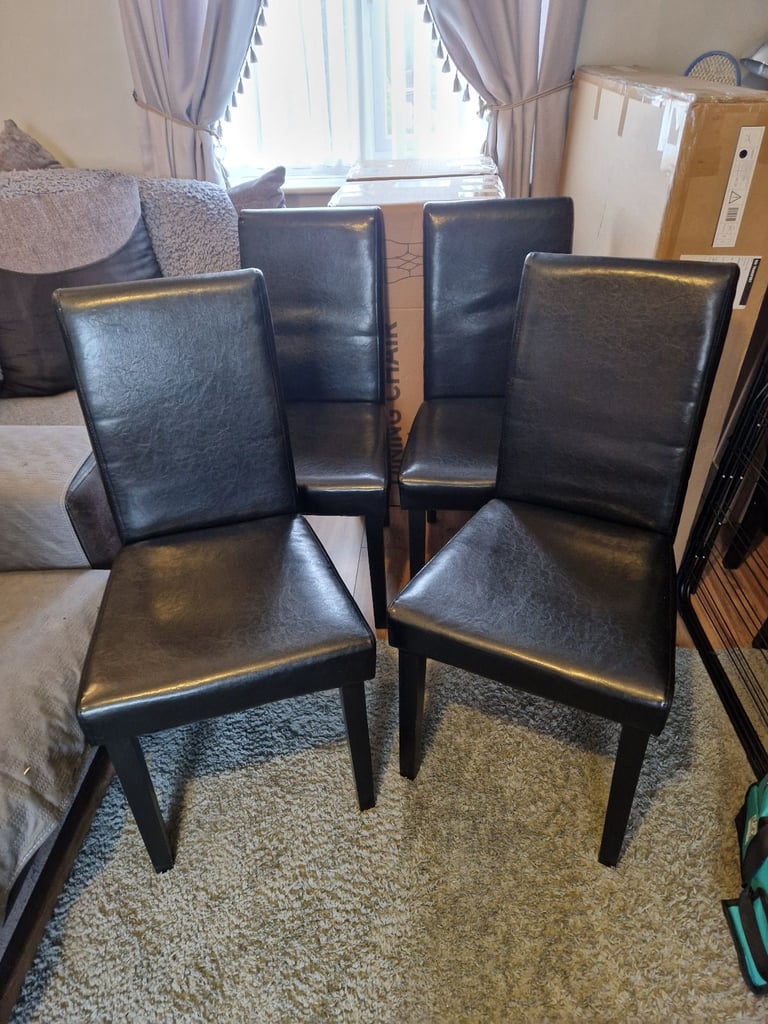 4 Black Faux Leather chairs