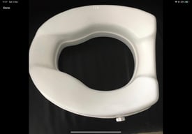 Two inch raised toilet seat eases transfer on and off toilet clip on 