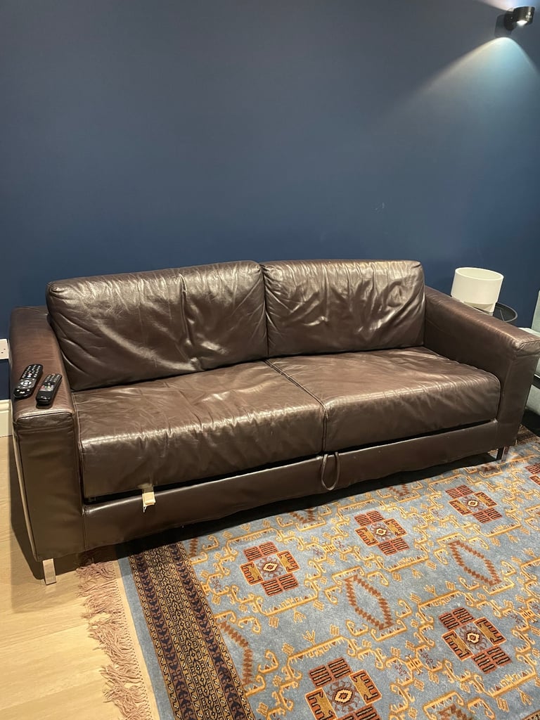 Brown leather sofa bed