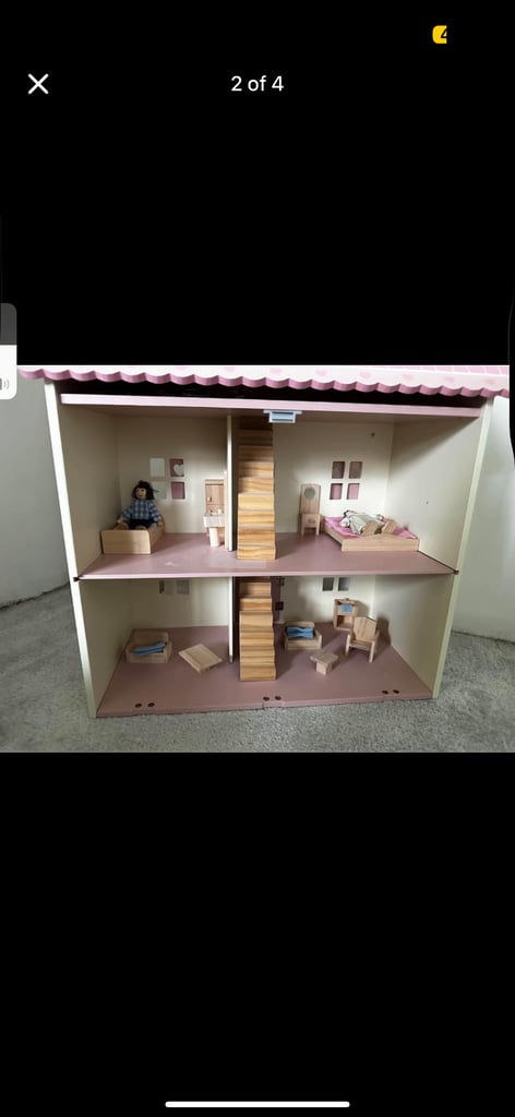 Girl pink dolls house with furnishings 