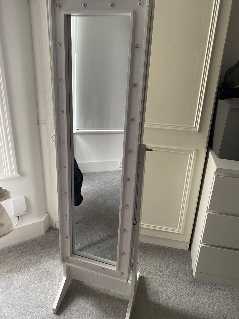 Mirror with lights and jewellery storage