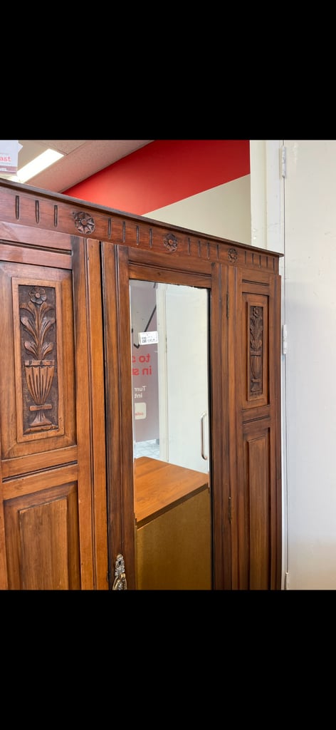 Beautiful dark wood wardrobe with carved flower inlay 