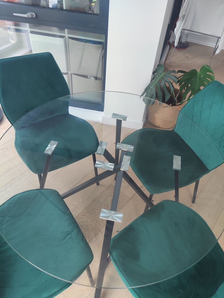 Glass table with four velvet chairs