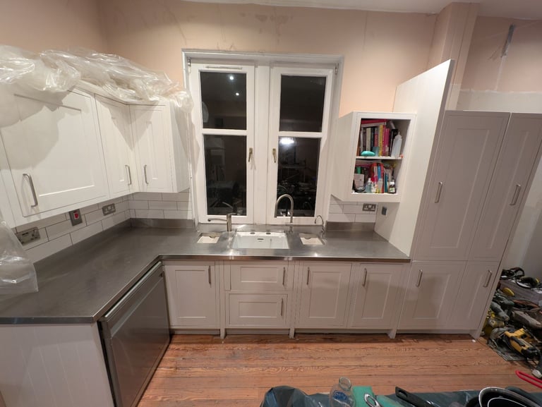Hand painted solid wood shaker kitchen with steel worktop and Belfast sinks. 