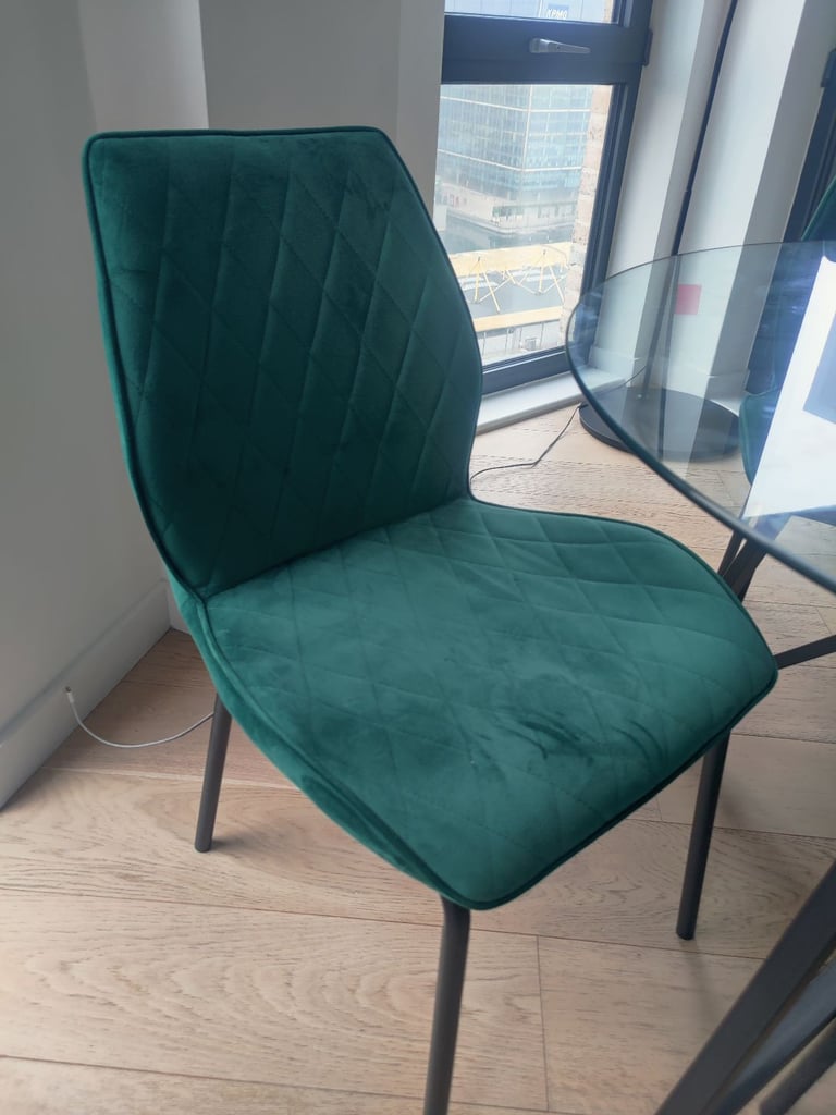 Glass table with four velvet chairs